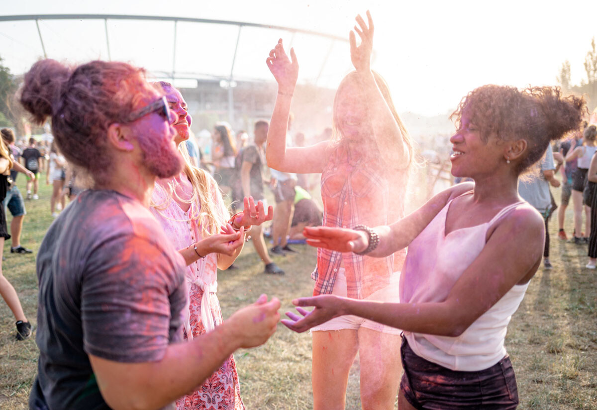 Group of friends having fun at festival.