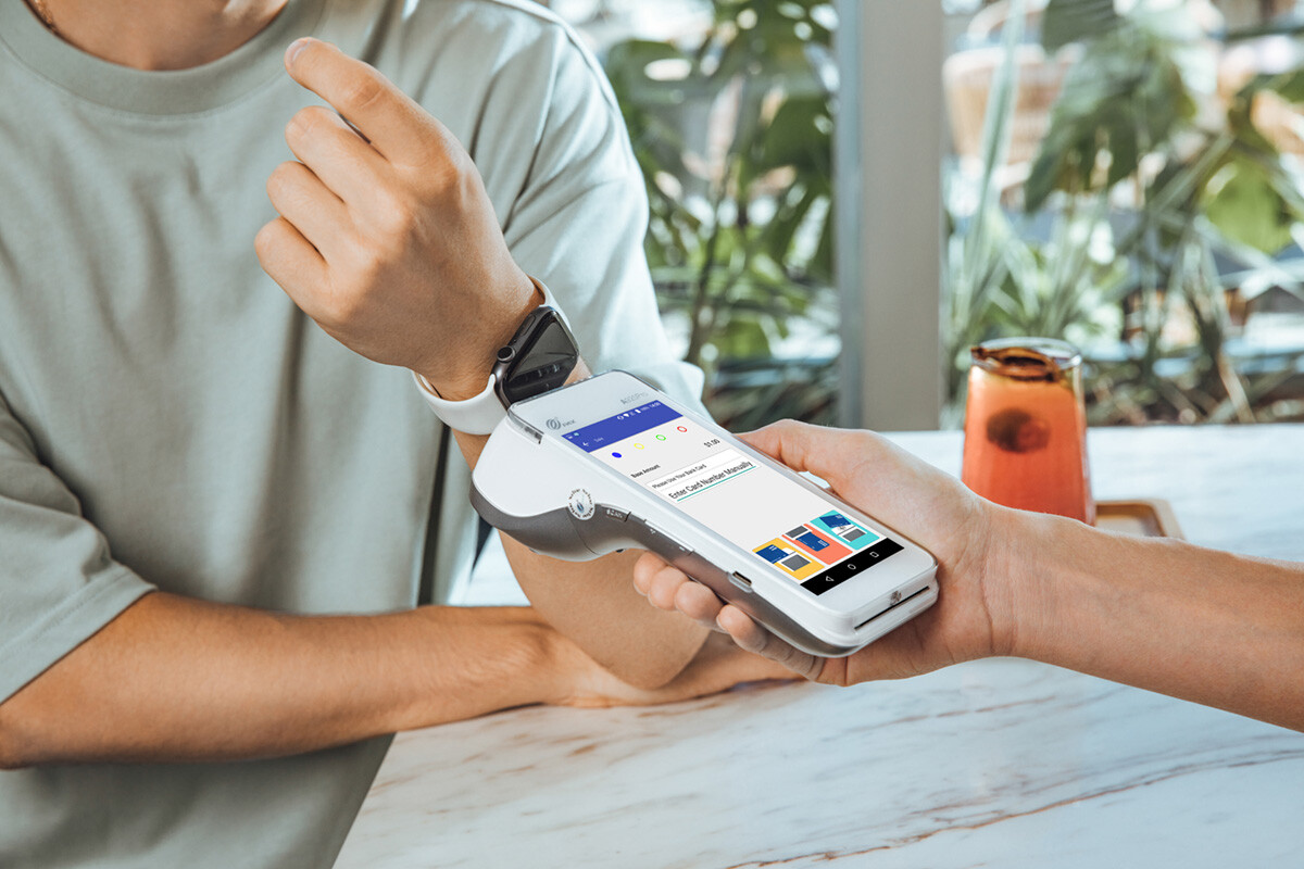 Paying with apple watch. Terminal Pax A920 Pro, lifestyle photo