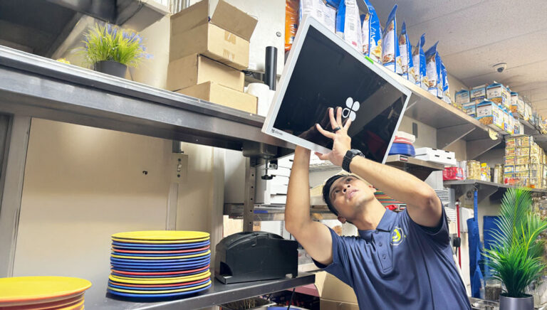 Christian installing a KDS at a local merchant in Hawaii